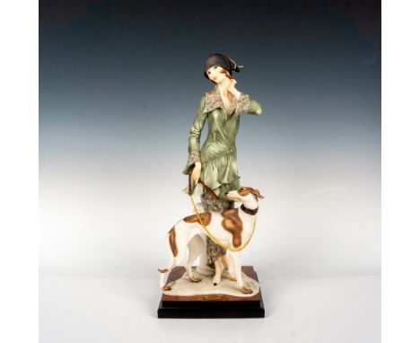 Captivating figurine of lady in flapper era dress with her elegant yet bewildered dog. Giuseppe Armani embossed to base. 1992