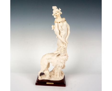Captivating figurine of lady in white with her beautiful white dog, model #952. Giuseppe Armani embossed to base. 1987 Floren