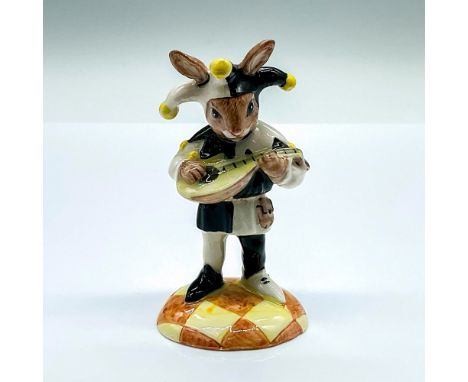 Prototype colorway porcelain figure of a jester playing the mandolin. Black and white attire with yellow pompoms. This Item I