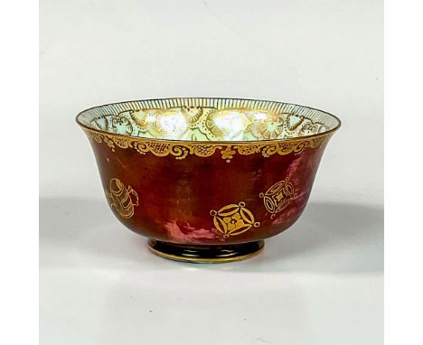 Decorated exterior with oriental motifs and symbols over a ruby mottling underglaze. Mother of pearl lustre interior with a s