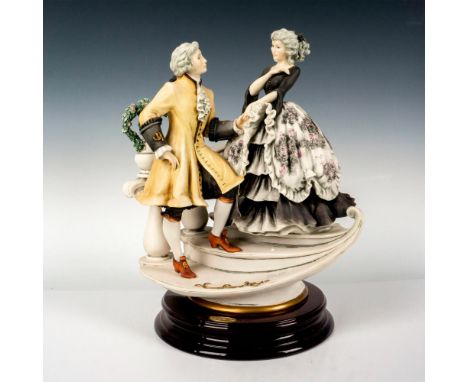 Limited edition featuring a lovely Victorian couple; on a round wooden base. Giuseppe Armani signature on porcelain. Official