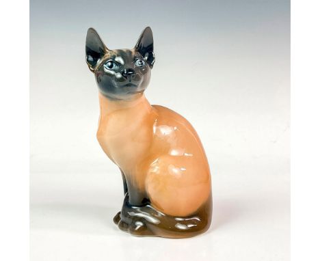 Glazed figurine of a cat in a seated position. Tan, grey and charcoal grey coloring. Royal Copenhagen item #3281. Royal Copen