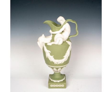 Exquisite green vessel featuring triton seated on the shoulder a marine monster grabbing its horns; stoneware, metal hardware