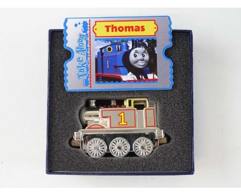 An RC2 "Take Along" Thomas the Tank Engine toy, chrome plated limited edition version issued only to toy retailers at the Toy
