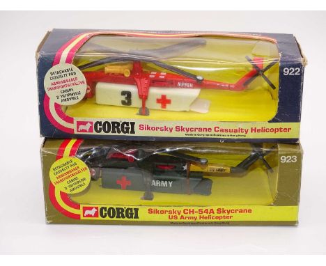 A pair of CORGI Toys Sikorsky Skycrane Helicopters to include: 922 Medical and 923 Army versions - G in Generally G boxes (2)