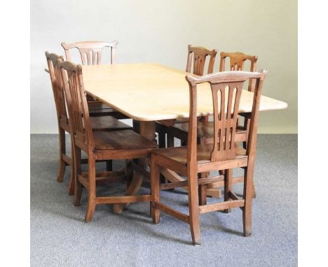 A set of six 19th century elm dining chairs, together with a modern light oak extending dining table, with one additional lea