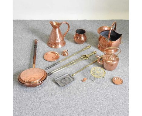 A set of brass fire tools, together with copper items, to include a coal scuttle and kettle