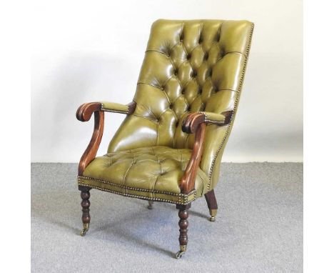 A green leather upholstered button back open arm chair, with scrolled arms, on turned legs