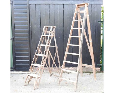 A wooden step ladder, 218cm high, together with another smaller (2)