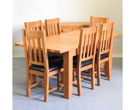 A light oak extending dining table, together with six dining chairs with padded seats and a sideboard (8)table 180w x 90d x 7