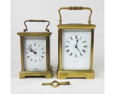 A brass cased carriage clock, with a white enamel dial, signed Howell &amp; James, 10 The Queen, London, 14cm high, together 