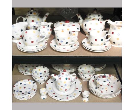 An Emma Bridgewater tea and dinner service, hand painted with coloured polka dots, to include teapots and jugs, together with