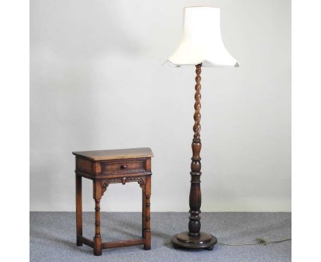 A modern oak standard lamp and shade, by Titchmarsh &amp; Goodwin, 176cm high overall, together with an oak credence table, o