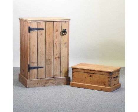 An antique pine cabinet, together with a pine trunk, flanked by carrying handles (2)164w x 51d x 98h cm