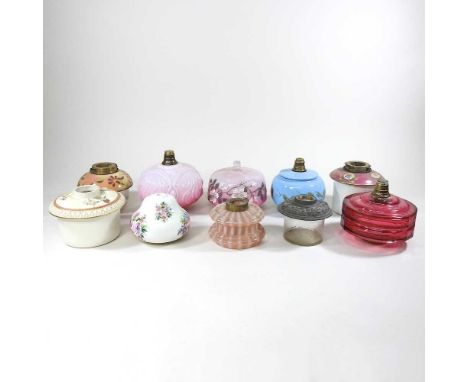 A collection of ten various oil lamp fonts, to include Worcester (10)