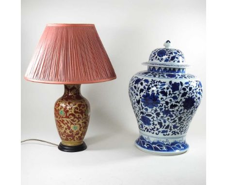 A modern Chinese blue and white jar and cover, 50cm high, together with a table lamp and shade (2)