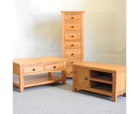 A light oak tall chest, together with a similar coffee table and a cabinet (3)chest 48w x 44d x 141h cm