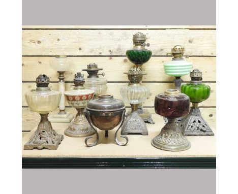 A collection of ten various oil lamps, to include an alabaster lamp, 43cm high (10)