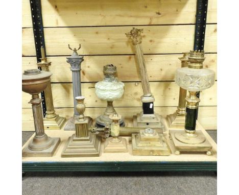 A collection of ten various oil lamp bases, to include a column lamp, 52cm high (10)