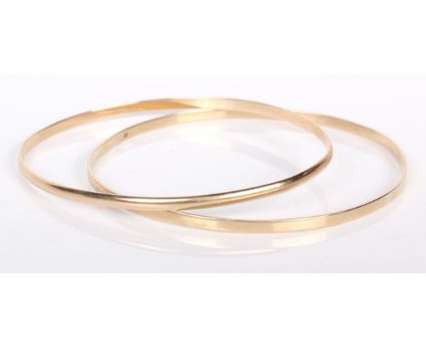 A 14ct gold bangle together with a 9ct bangle. 11.3g