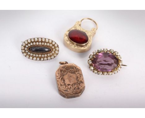 A yellow metal mourning locket set with cabochon garnet, a yellow metal and seed pearl mourning brooch, an amethyst seed pear