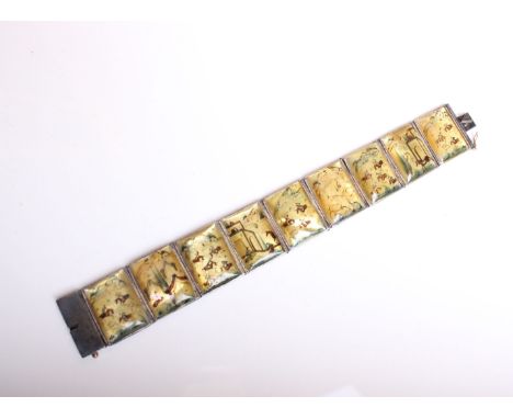 A Chinese mother of pearl panel bracelet in unmarked white metal together with a boxed sterling silver bangle.