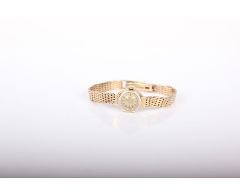 A 9ct gold ladies cocktail watch on a 9ct flat link bracelet strap by Rotary. 17.6g gross. 