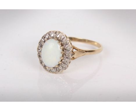 A 9ct gold opal and diamond ring, Central white opal with a surround of single cut diamonds(one diamond vacant). 2.5g Size S