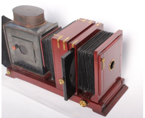 A late Victorian/Edwardian camera obscura slide projector, boxed with slides 45cm high, 78cm wide