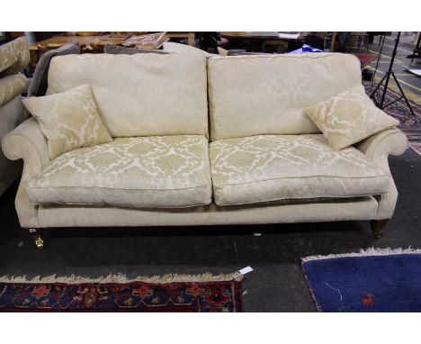 A modern three seater sofa 224cm length, together with two matching chairs 