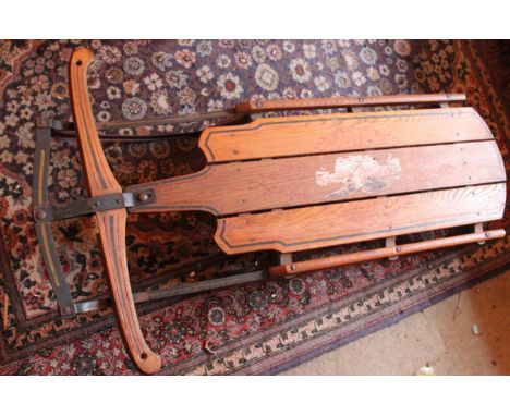 A painted American sled bearing makers marks 'Flexible Flyer'