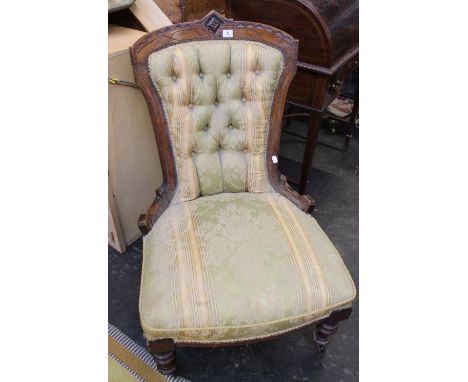 A Victorian walnut framed button back nursing chair 