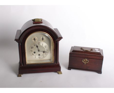 A Georgian style mahogany bracket clock the silvered dial with Roman Numerals, chime silent and slow/fast subsidiary dials 36