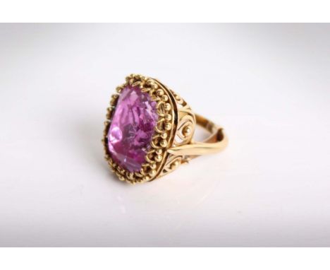 A 19th Century Pink Topaz Ring. Central cushion cut pink topaz approximately 16.40cts in a foiled mount and corded claw setti