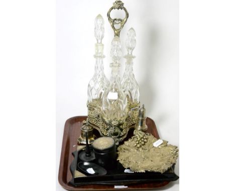 A silver plated triple decanter stand with three decanters, an ebony and silver part dressing table set with stand, a silver 