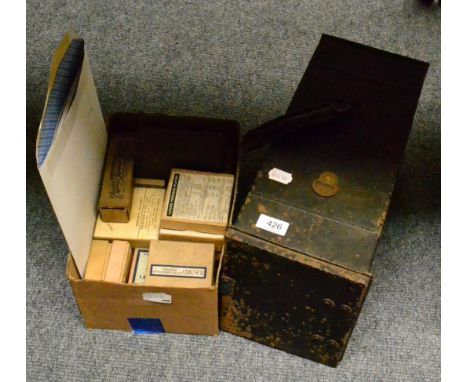 An Ensign Comet No.5 magic lantern together with over one hundred assorted 2inch square glass slides by Newton and Co etc, in