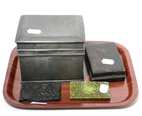 A Chinese engraved pewter casket caddy, 19th century, a green hardstone inkstone and two further inkstones, one cased 