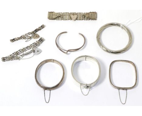 Two silver hinge opening bangles, three other bangles and three silver gate link bracelets 