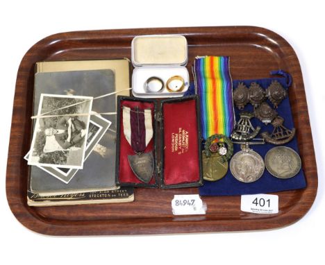 A First World War medal pair; two 22ct gold wedding bands; an 1821 crown; a silver and enamel shotting medal, cased; a small 