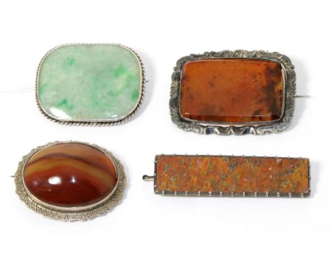 A jade brooch and three other hardstone brooches (4)