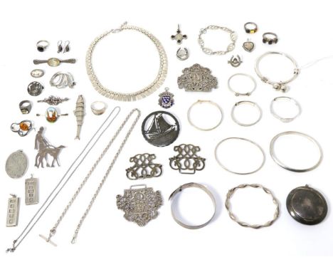 A compact, three silver bangles, two other bangles, two buckles, a silver fish pendant, two silver ingot pendants, enamel bro