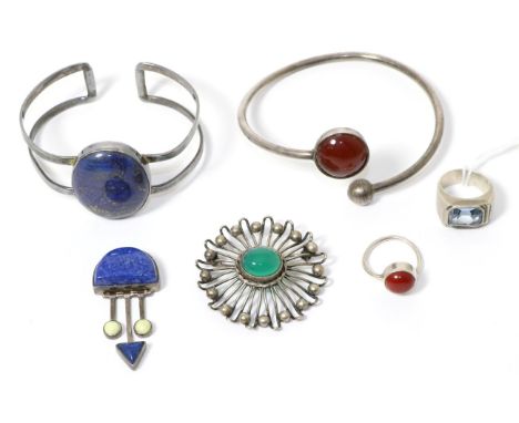 A Swedish silver chrysophase set brooch, a lapis lazuli set bangle, a carnelian set matching bangle and ring, a paste set pew