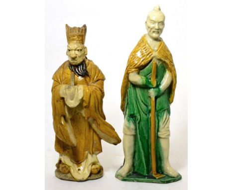 A Chinese pottery statue of a Daoist sage, 19th century, and a Chinese sancai pottery figure of a monk