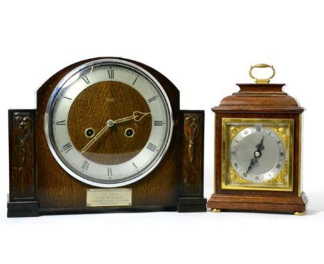 An oak veneered mantel clock with presentation plaque; and a small Elliot timepiece (2) 