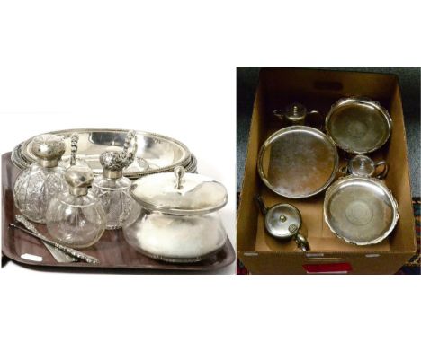 Three silver mounted cut glass spherical scent bottles; a silver topped glass dressing table pot; a smelling salts bottle; sh
