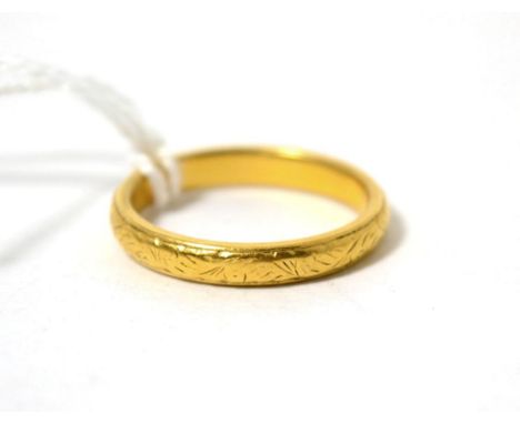 A 22ct gold band ring, finger size O