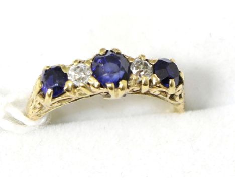 A sapphire and diamond ring, finger size N, stamped '18ct'3.4g