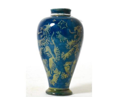 A blue lustre glazed vase decorated with lions rampant and white roses, stamped E.S.K. (Examined South Kensington) to base, 1