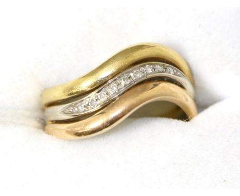 A diamond set three colour ring, finger size N, stamped '750'4.4g