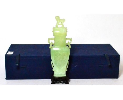 A jade type vase in archaic style, the lid surmounted by a dog of foe, 23cm high Very minor surface abrasions. 